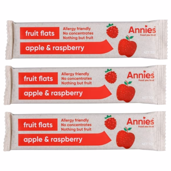 Three packets of apple and raspberry fruit flats by Annies, labelled as allergy friendly with no concentrates.