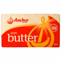 Block of Anchor pure butter weighing 500 grams with a red and yellow packaging design.